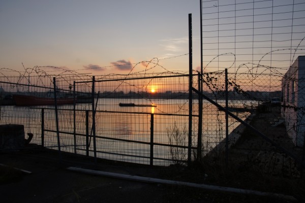 Sunset through fence